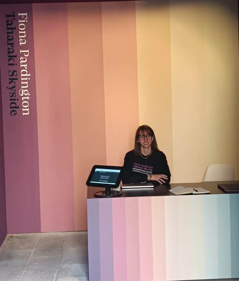 Giulia Naspi at the front desk of the Aotearoa New Zealand Pavilion at the Venie Biennale. Image supplied