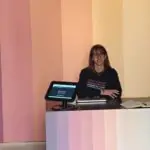 Giulia Naspi at the front desk of the Aotearoa New Zealand Pavilion at the Venie Biennale. Image supplied